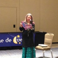 Maya Christina Gonzalez reading MY COLORS, MY WORLD/MIS COLORES, MI MUNDO during Noche de Cuentos