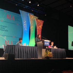 Silvia Cisneros, REFORMA president, presenting the Pura Belpré Award in English and Spanish